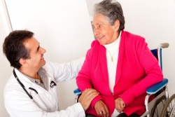 doctor checking the health of an elderly woman