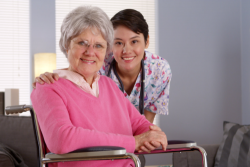smiling caregiver and elderly woman